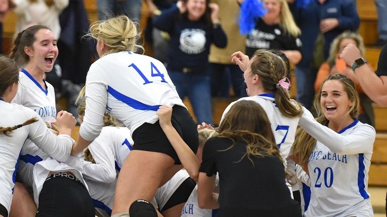 Long Beach celebrates winning the Nassau Class AA title on...