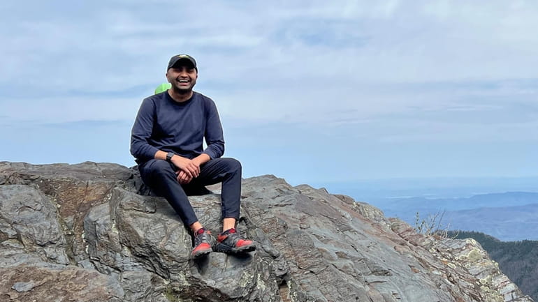 Prince Bhojwani sits on Charlies Bunion mountain along the Appalachian...
