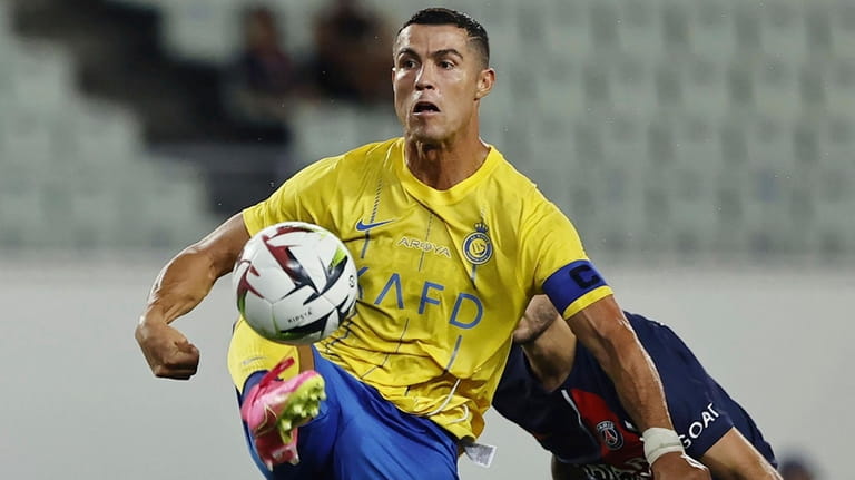 Al Nassr's Cristiano Ronaldo controls the ball during a friendly...