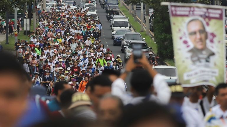 A religious procession marks the anniversary of the canonization of...