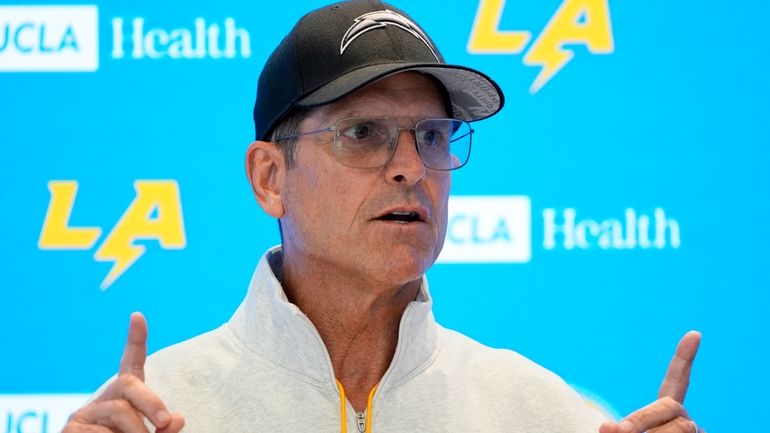 Los Angeles Chargers head coach Jim Harbaugh speaks at a...