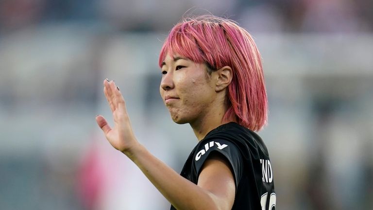 Angel City FC forward Jun Endo (18) waves to fans...