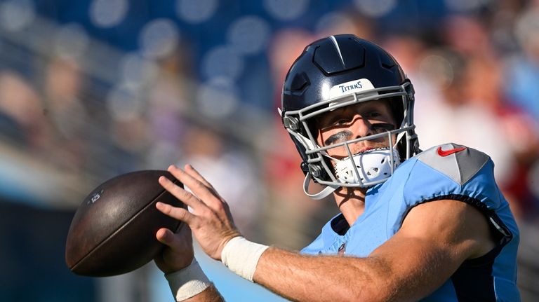 Tennessee Titans quarterback Will Levis warms up before playing the...