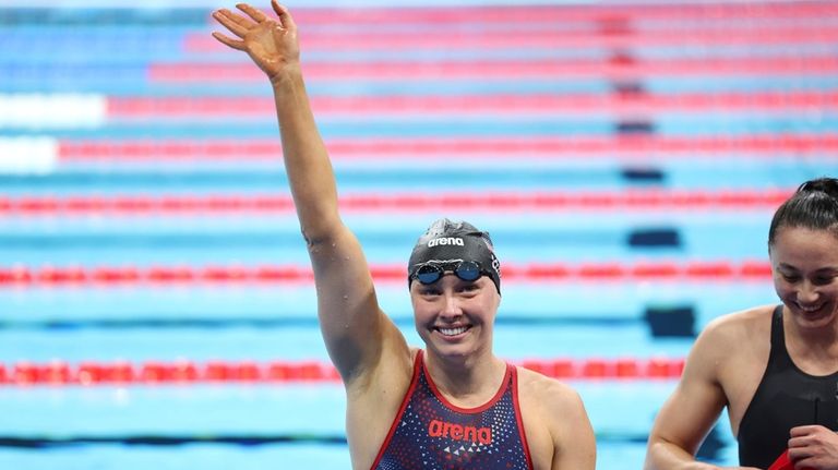 Jessica Long, of the U.S., waves to the crowd after...