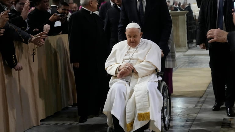 Pope Francis leaves after presiding over the liturgy of the...