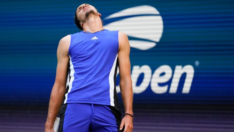 Alexander Zverev, of Germany, reacts in the fourth set against...