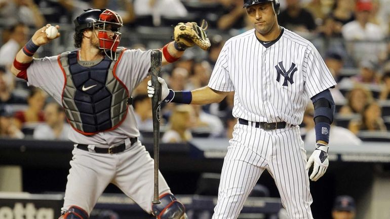 Derek Jeter strikes out in the fifth inning against the...