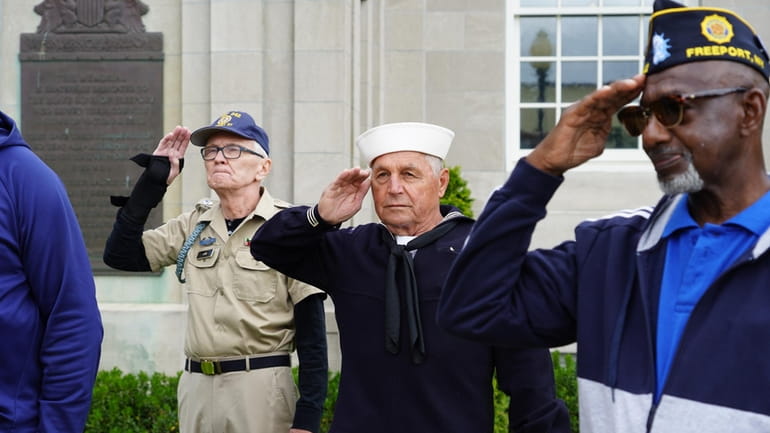 Veterans salute the flag at Freeport's 2021 Memorial Day parade.