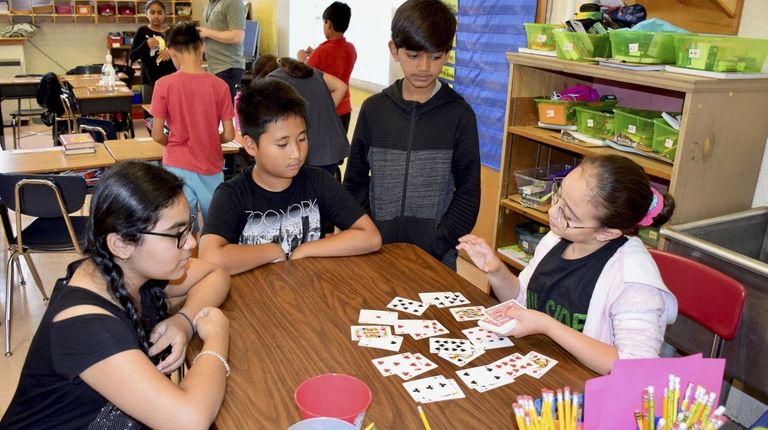 In New Hyde Park, fifth-graders in Peter Halligan's class participated...