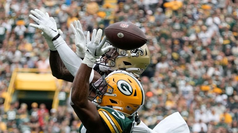 Green Bay Packers safety Rudy Ford breaks up a pass...