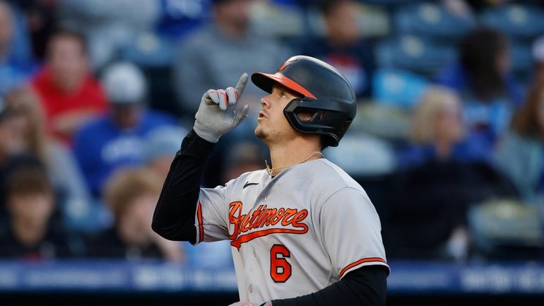 Baltimore Orioles' Ryan Mountcastle reacts as he crosses home plate...