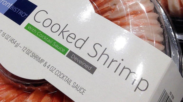 This Monday, Nov. 30, 2015 photo shows shrimp products from...