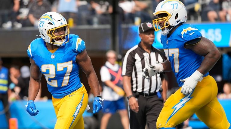 Los Angeles Chargers running back J.K. Dobbins (27) celebrates with...