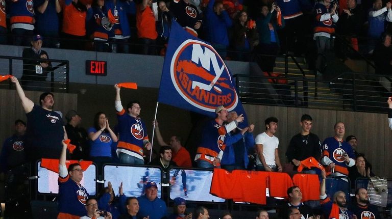 Islanders fans celebrate a during the third period of Game...