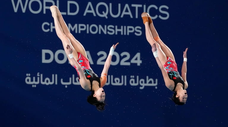 Chen Yuxi and Quan Hongchan, of China, compete during the...