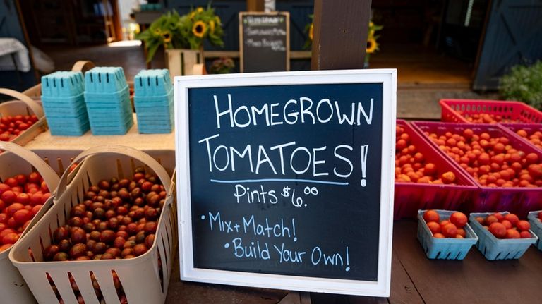 Schmitt's farmstand on Sound Avenue. He is concerned about the...