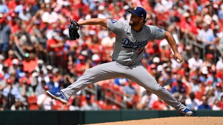 Los Angeles Dodgers starting pitcher Clayton Kershaw throws against the...