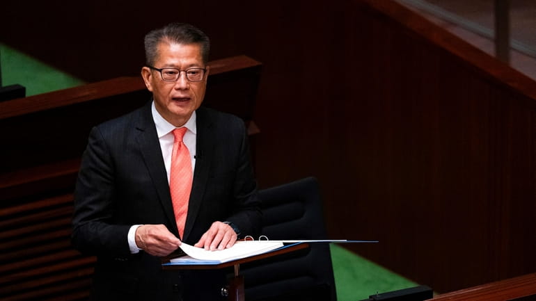 Hong Kong's Finance Secretary Paul Chan delivers the annual budget...