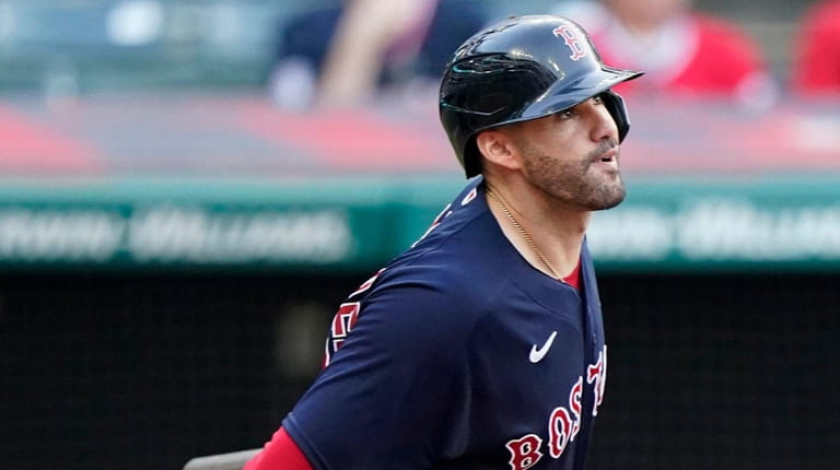 The Red Sox's J.D. Martinez watches his three-run home run in...