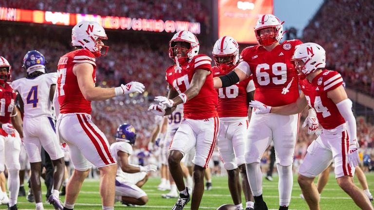 Nebraska wide receiver Jacory Barney Jr., center, celebrates after scoring...