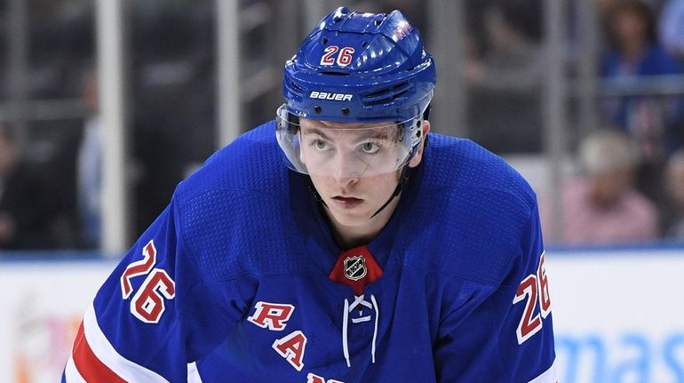 Rangers left wing Jimmy Vesey sets before a face-off against...