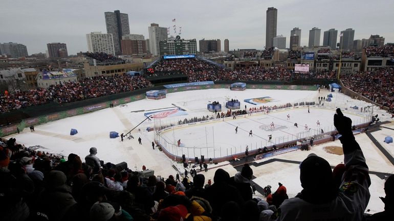 In this Jan. 1, 2009 file photo, fans cheer during...