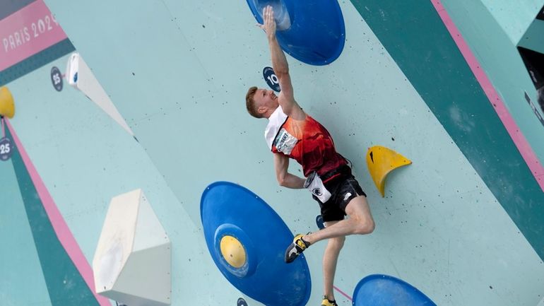 Jakob Schubert of Austria competes in the men's boulder and...