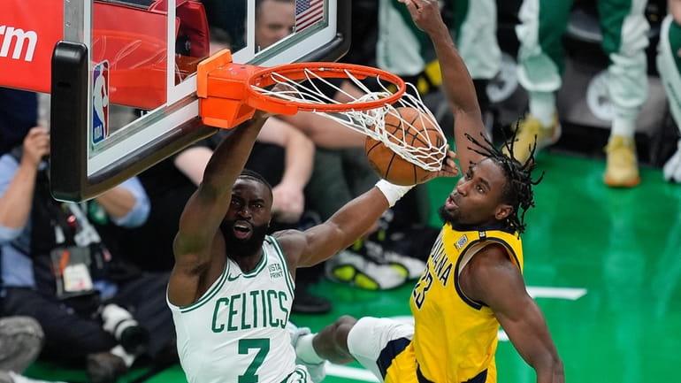 Boston Celtics guard Jaylen Brown (7) dunks the ball against...