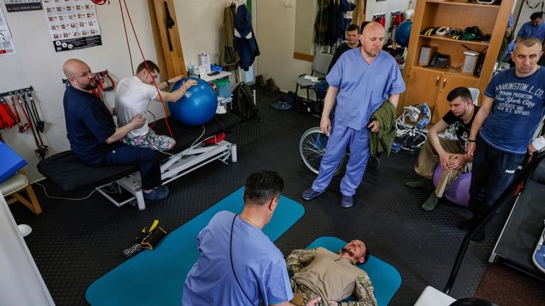 Medical workers do gymnastics with the Ukrainian servicemen during rehabilitation...