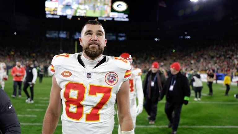 Kansas City Chiefs tight end Travis Kelce (87) walks off...