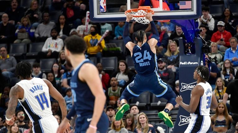 Memphis Grizzlies forward Dillon Brooks (24) dunks in the first...