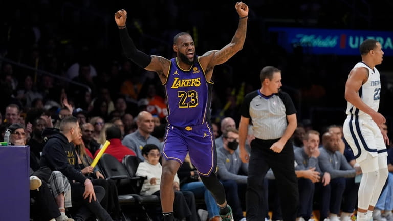 Los Angeles Lakers forward LeBron James (23) celebrates after scoring...