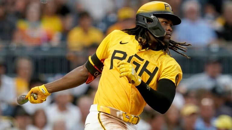 Pittsburgh Pirates' Oneil Cruz watches his RBI single during the...