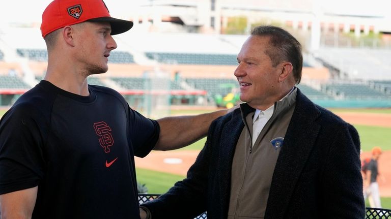 New San Francisco Giants infielder Matt Chapman, left, talks with...