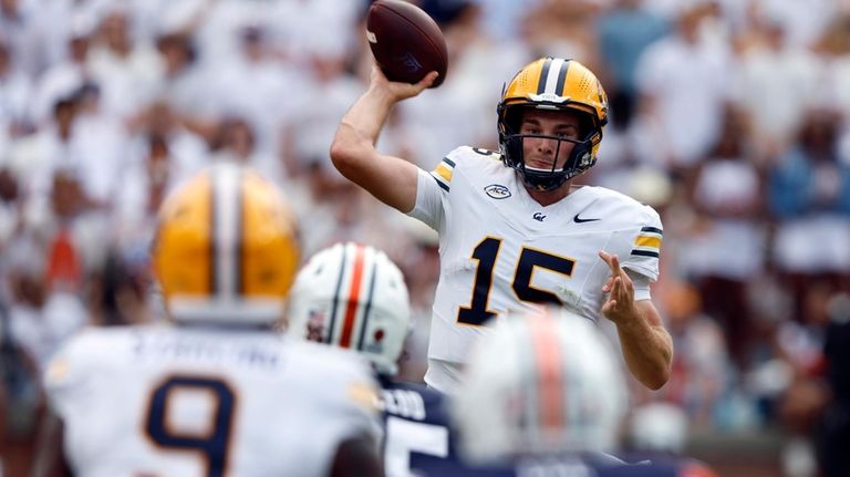 California quarterback Fernando Mendoza (15) looks to throw a pass...