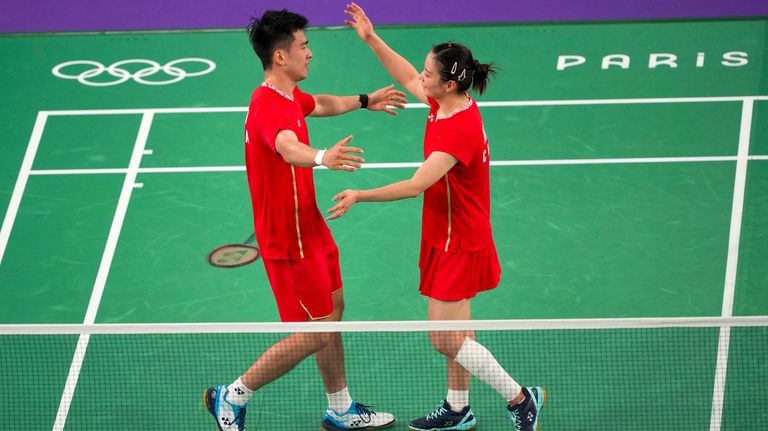 China's Zheng Si Wei, left, and Huang Ya Qiong celebrate...