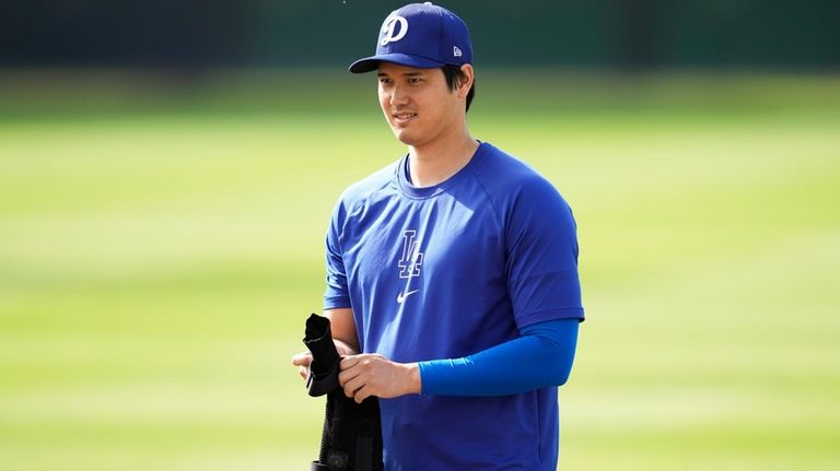 Los Angeles Dodgers designated hitter Shohei Ohtani participates in spring...