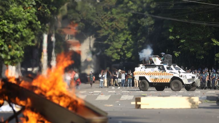 Police fire tear gas shells and rubber bullets to disperse...