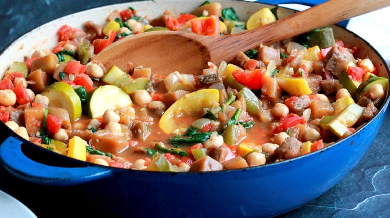 Eggplant, zucchini, summer squash, tomatoes, bell peppers and chickpeas simmer...