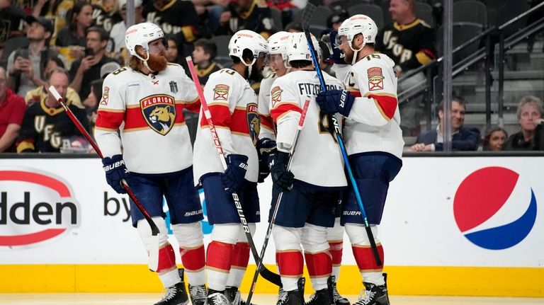 Florida Panthers center Anton Lundell celebrates his goal with teammates...