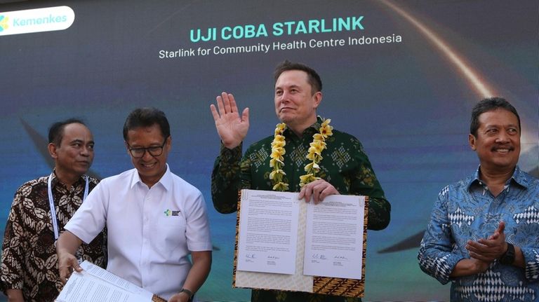 Indonesian Minister of Health, Budi Gunadi Sadikin, second from left,...