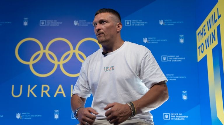 World Heavyweight boxing champion Oleksandr Usyk speaks during a visit...