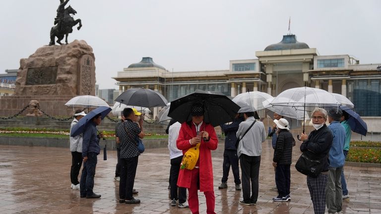 Korean tourists visit Sukhbaatar Square in Ulaanbaatar, Mongolia on June...