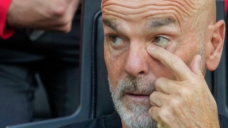 AC Milan's manager Stefano Pioli looks out from the bench...