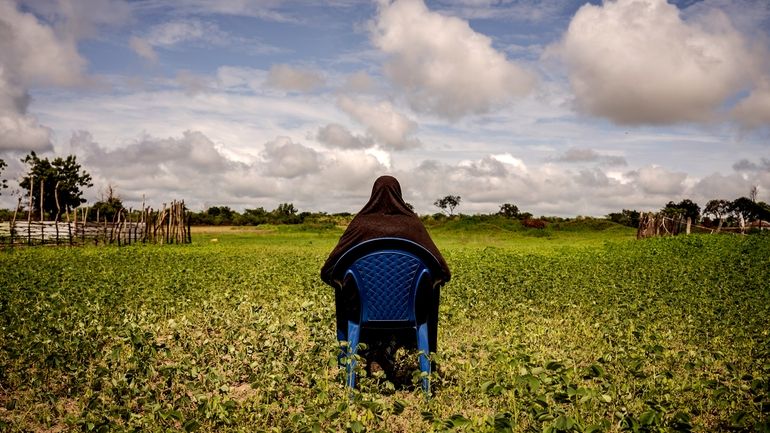 Meta, a survivor of female genital mutilation, poses for a...