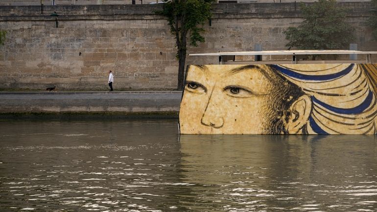 Reproductions of artworks decorate the banks of the River Seine...