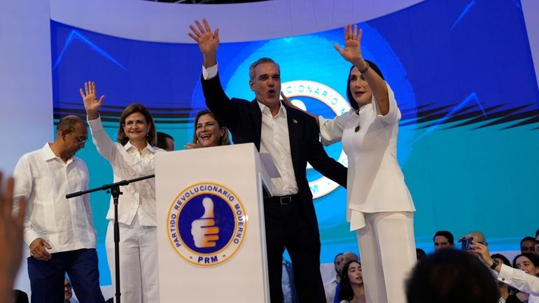 Incumbent presidential candidate Luis Abinader, second from right, addresses supporters...