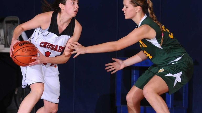 Long Island Lutheran High School senior Paige Krifcher, left, looks...