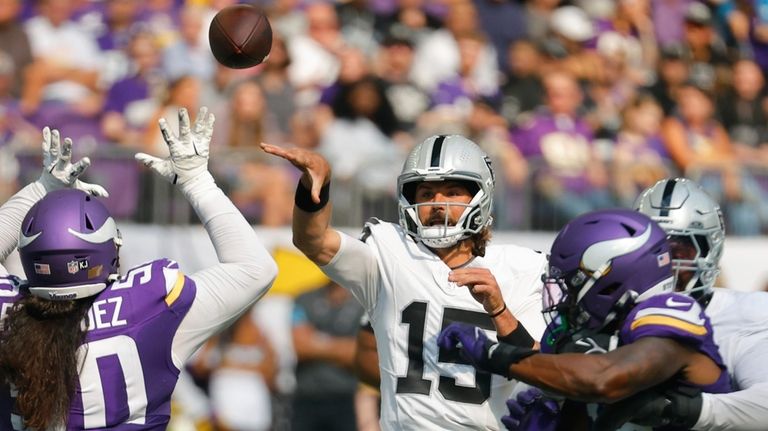 Las Vegas Raiders quarterback Gardner Minshew II (15) throws against...