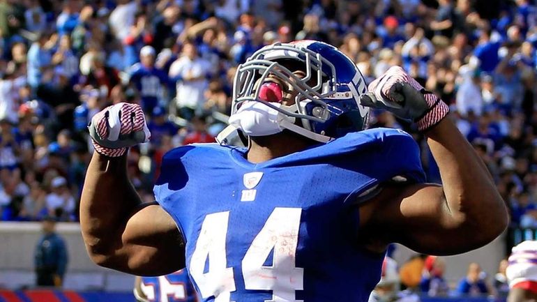 Ahmad Bradshaw #44 of the New York Giants celebrates his...